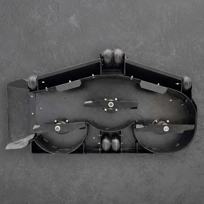 A black V-600-Series mower deck with two large cutting blades and caster wheels, shown from above on a dark textured surface.