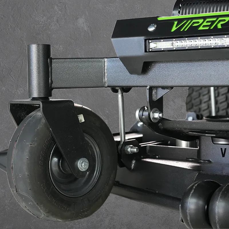 A close-up of a black Viper exercise machine wheel and frame against a dark textured background.
